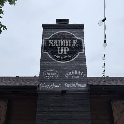 Saddle Up building at night